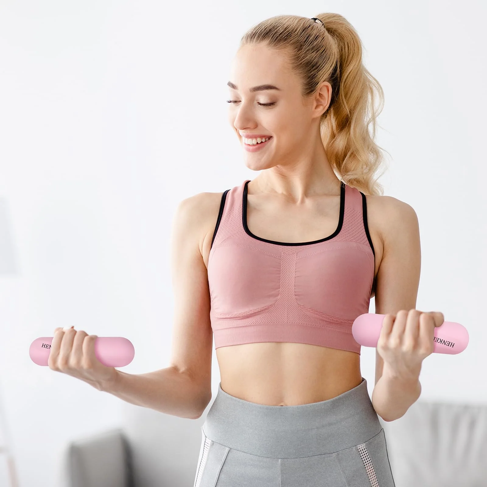 Pink dumbbells for arm work at home