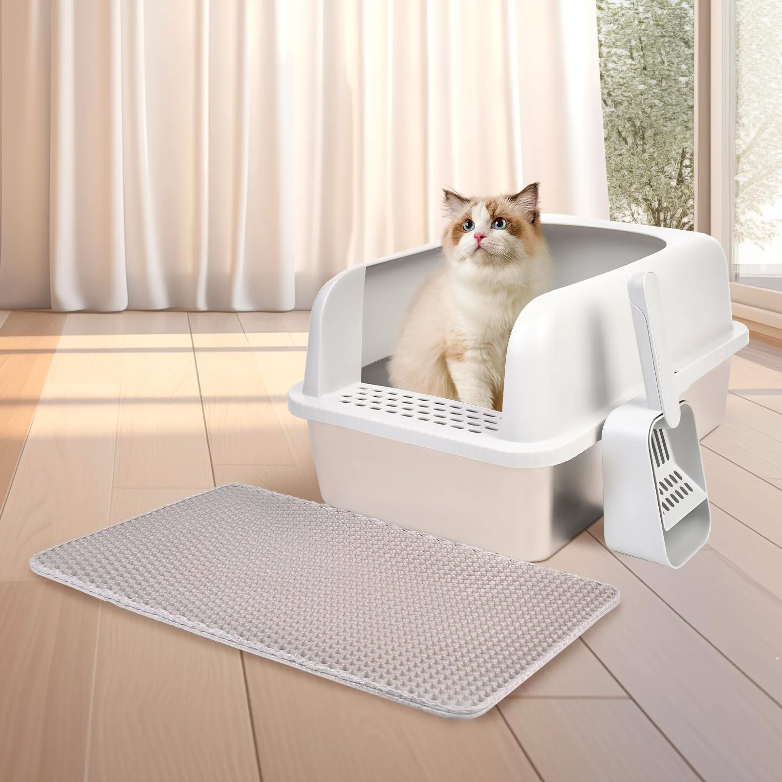 A cream cat sits in the Henkelion stainless steel litter box in a sunny living room